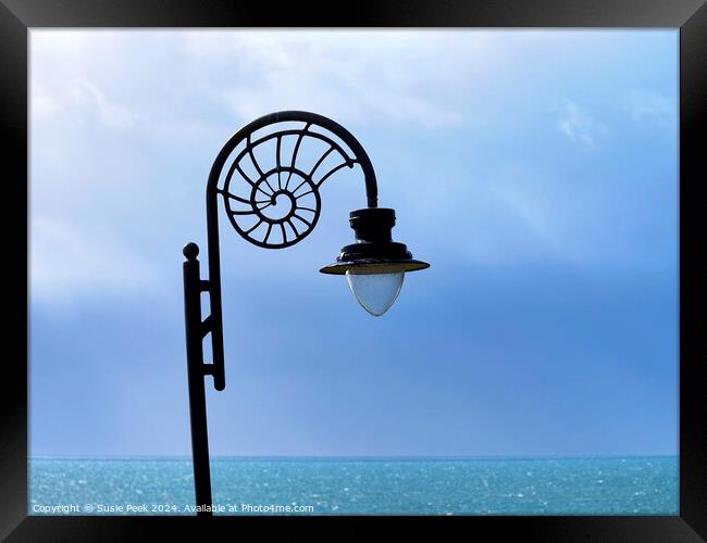 Nautilus-design Lamp against Stormy Ocean Blues  Framed Print by Susie Peek