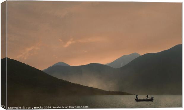Sunset over the mountains with a silhouetted fishing boat Canvas Print by Terry Brooks