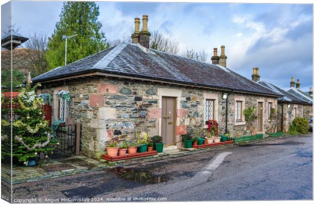 Cottages on Pier Road in Luss, Scotland Canvas Print by Angus McComiskey