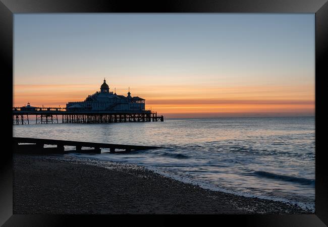 Sunrise over Eastbourne Pier, East Sussex, England Framed Print by Dave Collins