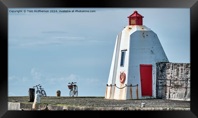 Bicycles at the Pier Framed Print by Tom McPherson