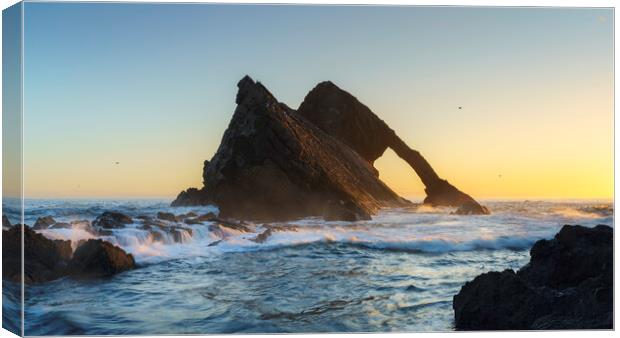 Golden Sunrise on Bow Fiddle Rock Canvas Print by Anthony McGeever