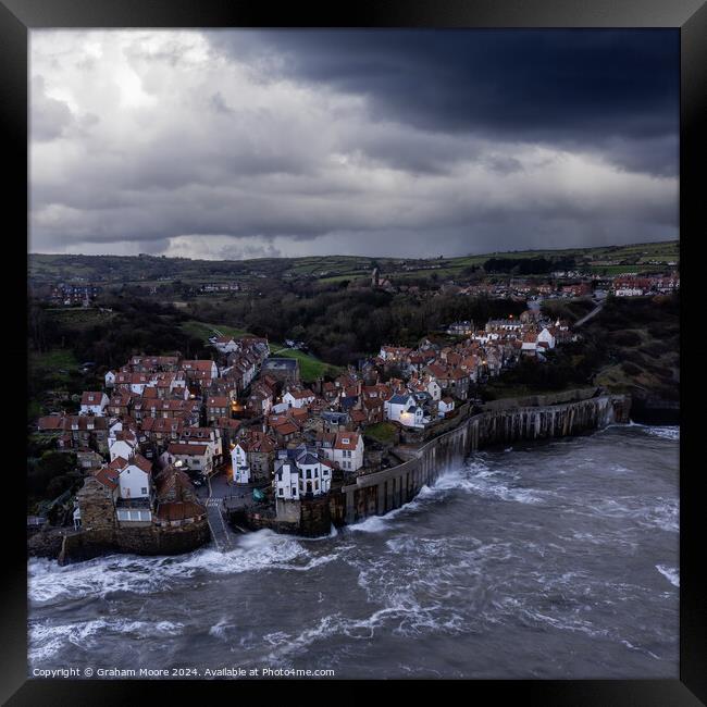 Robin Hoods Bay evening moody sky Framed Print by Graham Moore