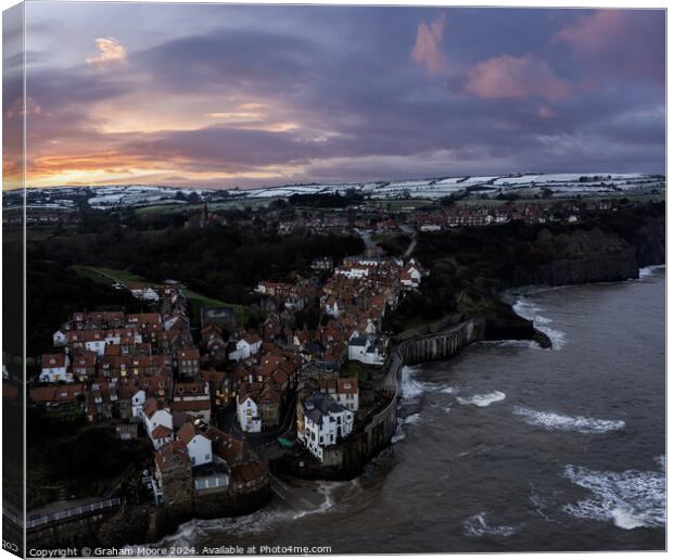Robin Hoods Bay in snow sunset tide in Canvas Print by Graham Moore
