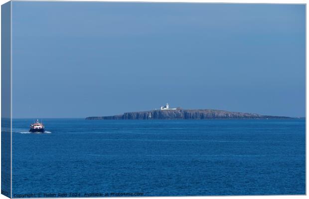 Northhumberland Farne lighthouse with a passenger boat Canvas Print by Helen Reid
