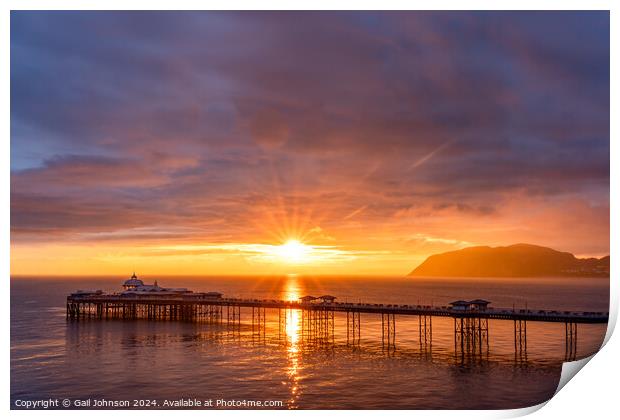 Sunrise over llandudno Pier with the tide in  Print by Gail Johnson