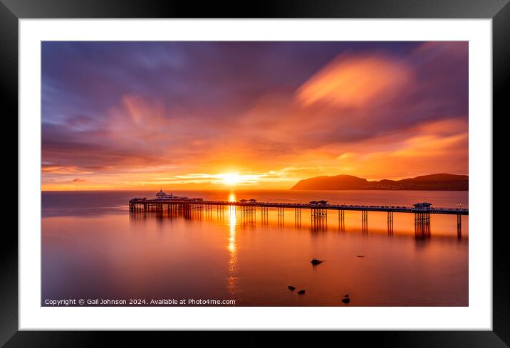 Sunrise over llandudno Pier with the tide in  Framed Mounted Print by Gail Johnson