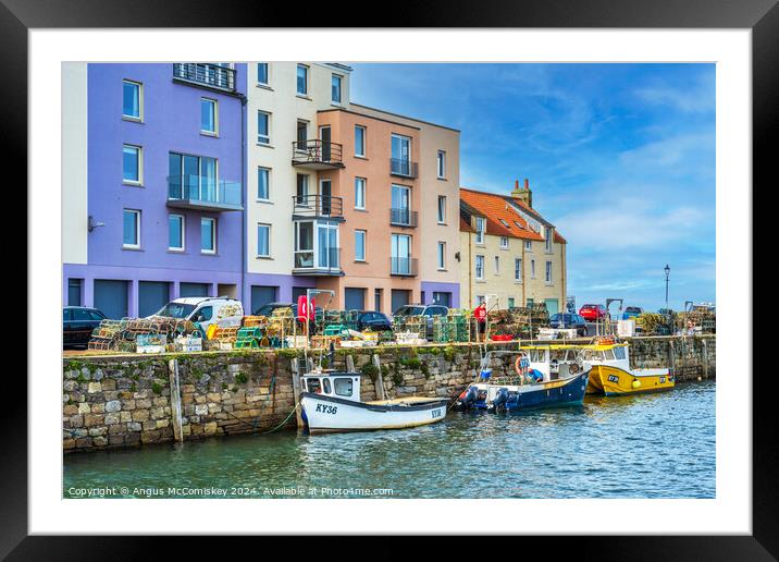 Colourful quayside buildings on St Andrews harbour Framed Mounted Print by Angus McComiskey