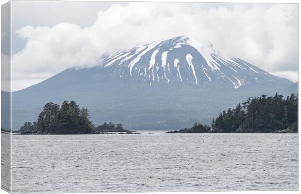 Islands and Snow Topped Mountains at Sitka, Alaska, USA. Canvas Print by Dave Collins