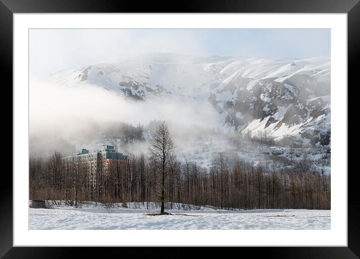 Mist and Fog swirls around Begich Towers Condominium building and the mountains behind, Whittier, Alaska, USA Framed Mounted Print by Dave Collins