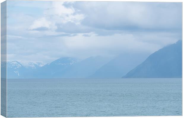 Distance Mountains in mist in Prince William Sound, Alaska, USA Canvas Print by Dave Collins