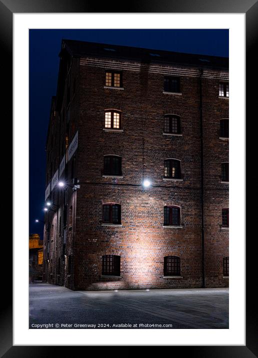 Illuminated Victorian Red Brick Warehouse At The Historic Docks  Framed Mounted Print by Peter Greenway