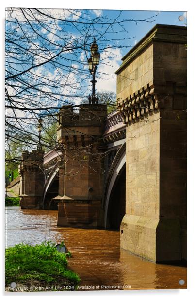 Scenic view of an old stone bridge with arches over a river, framed by blue skies and greenery, with a vintage street lamp adding to the historic charm in York, North Yorkshire, England. Acrylic by Man And Life