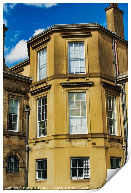 Classic European architecture with a clear blue sky. The building features a warm beige facade, large windows, and traditional stonework details in York, North Yorkshire, England. Print by Man And Life