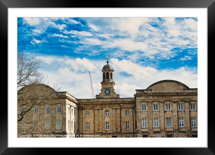 Historic stone building with a central clock tower under a blue sky with fluffy clouds, featuring classic architecture and a construction crane in the background in York, North Yorkshire, England. Framed Mounted Print by Man And Life