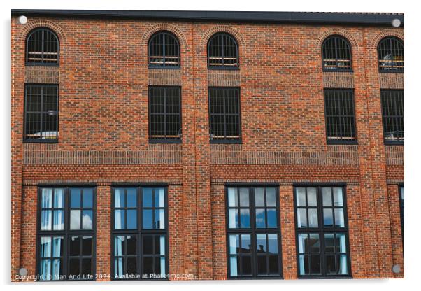 Facade of a vintage brick building with rows of windows reflecting the sky, showcasing industrial architecture in York, North Yorkshire, England. Acrylic by Man And Life