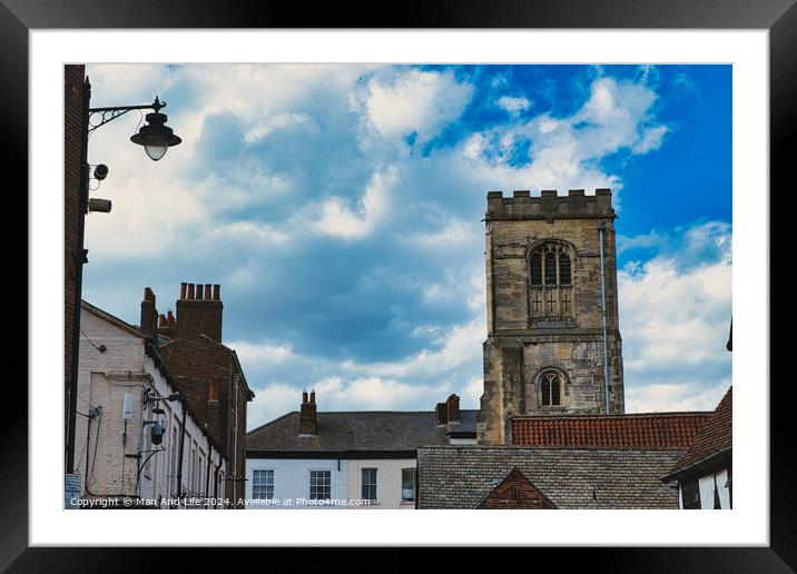 Quaint European street with historic buildings and a prominent church tower under a dramatic sky with fluffy clouds in York, North Yorkshire, England. Framed Mounted Print by Man And Life
