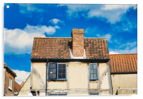 Old European building with weathered facade and terracotta roof tiles against a backdrop of a vibrant blue sky with fluffy clouds in York, North Yorkshire, England. Acrylic by Man And Life