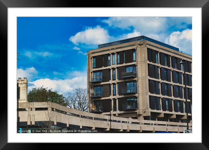 Modern urban apartment building with balconies against a blue sky with fluffy clouds. Architectural exterior of residential structure in a city setting in York, North Yorkshire, England. Framed Mounted Print by Man And Life