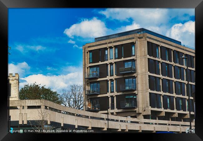 Modern urban apartment building with balconies against a blue sky with fluffy clouds. Architectural exterior of residential structure in a city setting in York, North Yorkshire, England. Framed Print by Man And Life