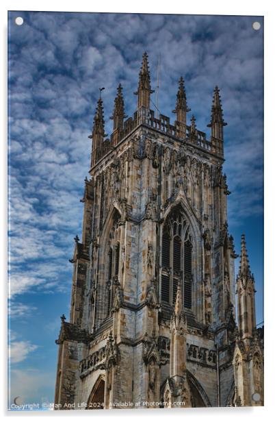 Gothic cathedral tower against a dramatic cloudy sky, showcasing intricate architectural details and spires, ideal for historical or religious themes in York, North Yorkshire, England. Acrylic by Man And Life