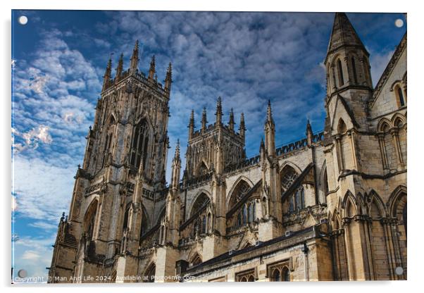 Gothic cathedral tower against a dramatic cloudy sky, showcasing intricate architectural details and spires, ideal for historical or religious themes in York, North Yorkshire, England. Acrylic by Man And Life