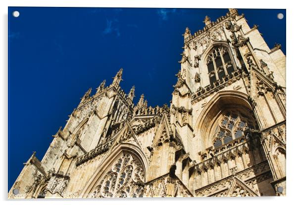 Gothic cathedral facade against a clear blue sky, showcasing intricate architectural details and stone carvings, perfect for historical and travel themes in York, North Yorkshire, England. Acrylic by Man And Life