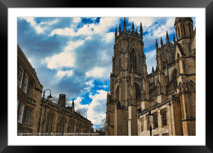 Dramatic sky over a majestic Gothic cathedral with intricate architecture, flanked by historic buildings, showcasing a blend of heritage and natural beauty in York, North Yorkshire, England. Framed Mounted Print by Man And Life