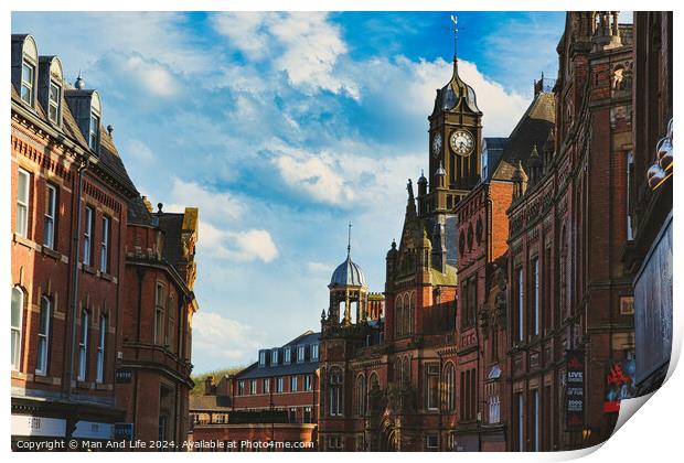 Historic European architecture with a clock tower under a blue sky with clouds. Old buildings with intricate details in a cityscape in York, North Yorkshire, England. Print by Man And Life