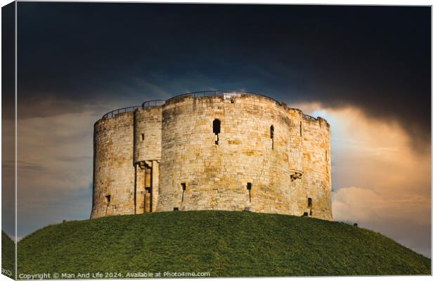 Dramatic sky over an ancient stone fortress atop a lush green hill, symbolizing historical strength and medieval architecture in York, North Yorkshire, England. Canvas Print by Man And Life