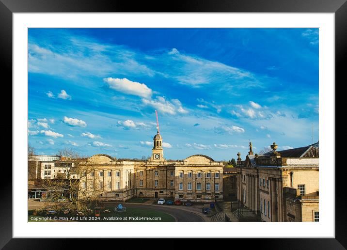 Historic building with a clock tower under a blue sky with fluffy clouds in York, North Yorkshire, England. Framed Mounted Print by Man And Life