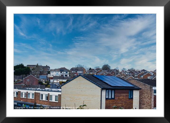Suburban landscape with residential houses featuring solar panels under a dynamic blue sky with wispy clouds, showcasing sustainable living in a modern neighborhood in Harrogate, North Yorkshire. Framed Mounted Print by Man And Life