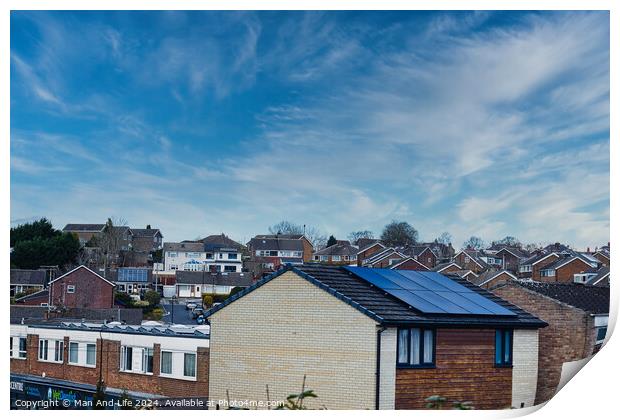 Suburban landscape with residential houses featuring solar panels under a dynamic blue sky with wispy clouds, showcasing sustainable living in a modern neighborhood in Harrogate, North Yorkshire. Print by Man And Life