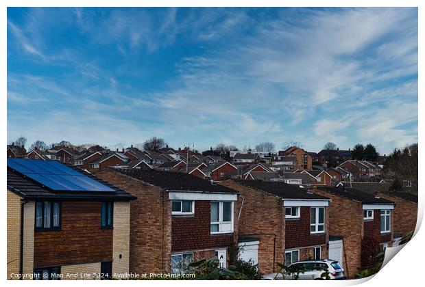 Suburban landscape with rows of British houses, featuring solar panels on roofs under a dynamic blue sky with wispy clouds in Harrogate, North Yorkshire. Print by Man And Life