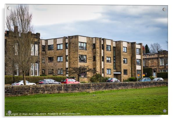 Modern residential apartment buildings with parked cars in front, behind a stone wall with a lush green lawn in the foreground. Urban living concept in Harrogate, North Yorkshire. Acrylic by Man And Life