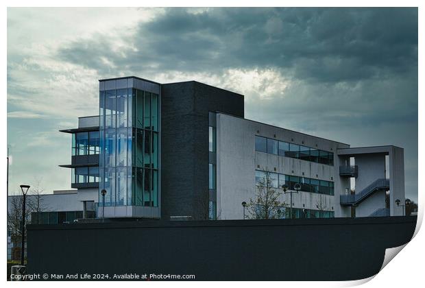 Modern office building against a dramatic cloudy sky, showcasing contemporary architecture with a mix of glass and concrete elements. Print by Man And Life