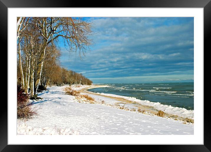 Snow on lake shore in Winter Framed Mounted Print by Pete Klinger