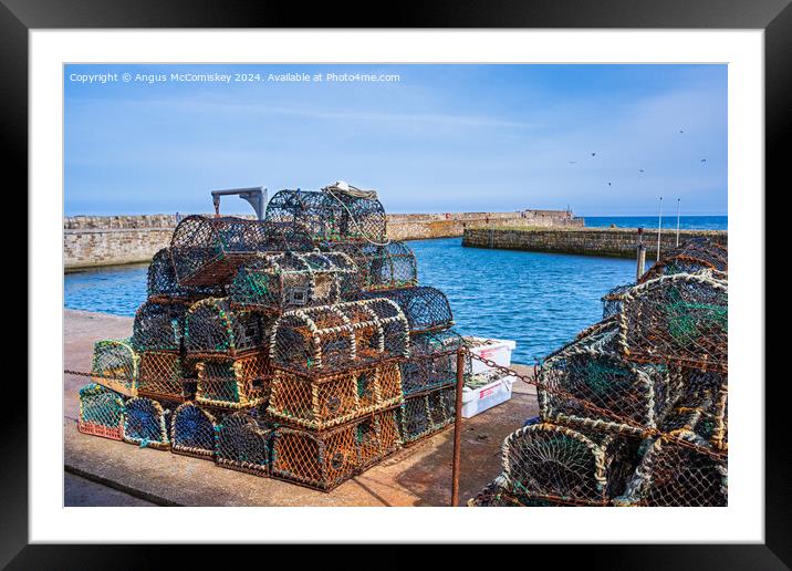 Lobster pots on quayside at St Andrews harbour Framed Mounted Print by Angus McComiskey