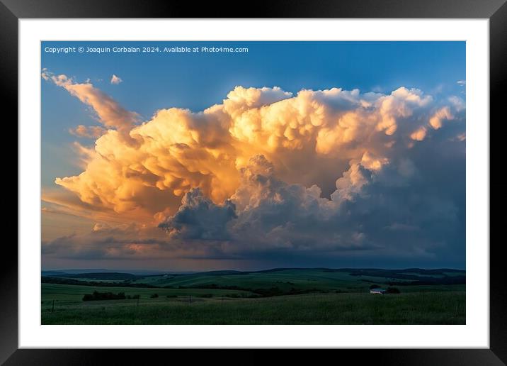 A massive, dramatic cloud looming in the sky, creating a striking scene. Framed Mounted Print by Joaquin Corbalan