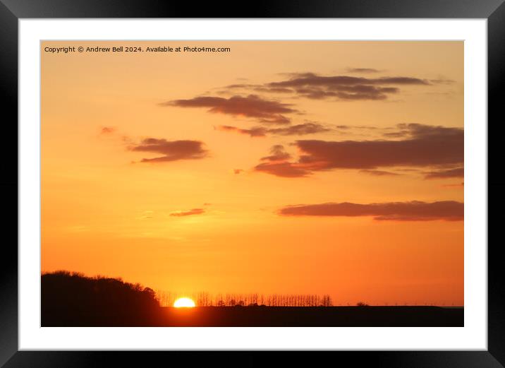 Sunset clouds and silhouettes Framed Mounted Print by Andrew Bell