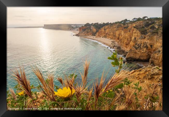 The rugged coastline at dawn, overlooking beach near Lagos in th Framed Print by Laurent Renault