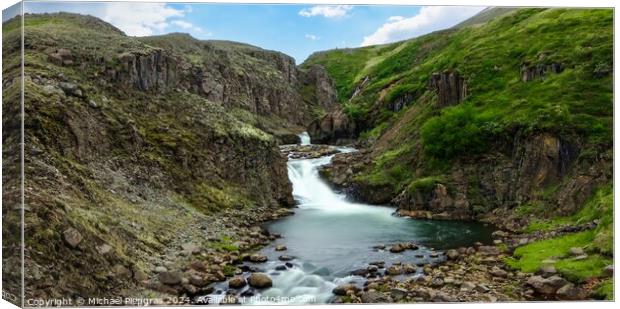 Long exposure of a waterfall in a rocky landscape in Iceland Canvas Print by Michael Piepgras