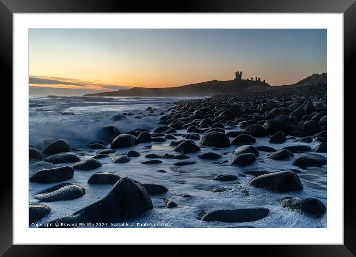 Boulder Beach and Dunstanburgh Castle at dawn Framed Mounted Print by Edward Bilcliffe