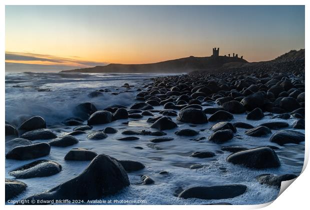 Boulder Beach and Dunstanburgh Castle at dawn Print by Edward Bilcliffe