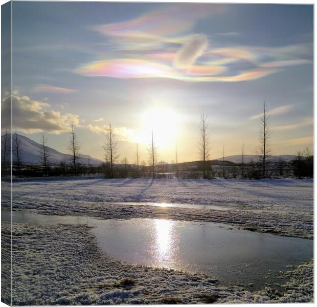 Nacreous clouds over a snowy landscape  Canvas Print by Robert Galvin-Oliphant