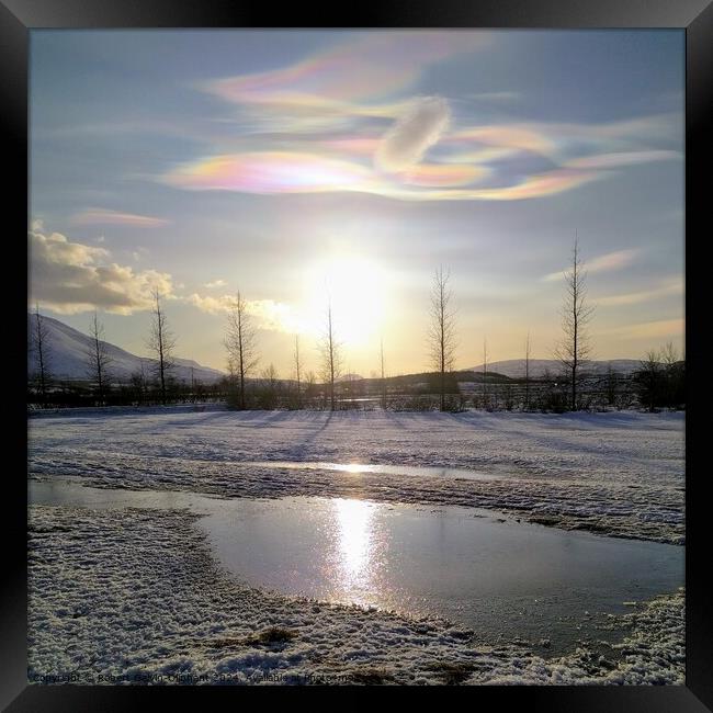 Nacreous clouds over a snowy landscape  Framed Print by Robert Galvin-Oliphant