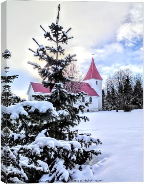 Iceland church and trees in snow  Canvas Print by Robert Galvin-Oliphant