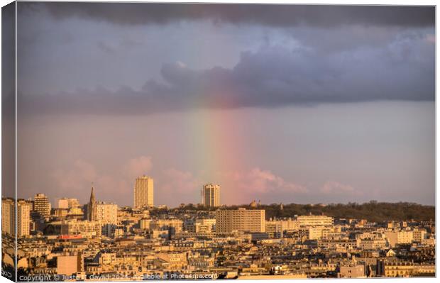 Cityscape Paris with a rainbow Canvas Print by Justo II Gayad