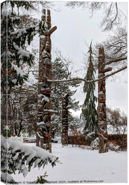 Totem poles in snow Canvas Print by Robert Galvin-Oliphant