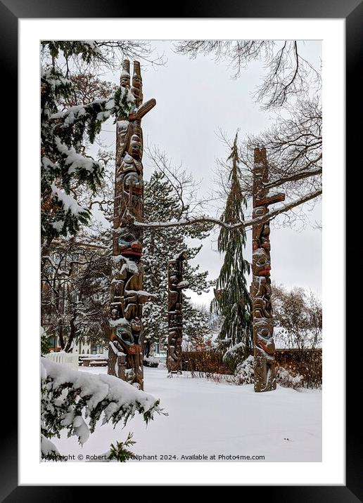 Totem poles in snow Framed Mounted Print by Robert Galvin-Oliphant